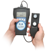 Two hands holding the XRP-3000A AccuMAX™ Digital Radiometer / Photometer